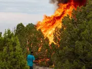 Helicopter battling Utah wildfire crashes with two aboard