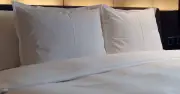 Hotel cleaner shares simple spray trick for wrinkle-free sheets