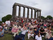 Hundreds gather on Calton Hill to watch rare solar eclipse in Edinburgh