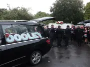 Hundreds in red and black mourn Ben Dooley at Anfield funeral