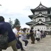 Hundreds pull giant castle for repairs in epic tug-of-war
