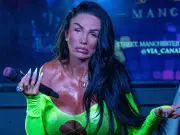 Katie Price performs at Manchester Pride in neon bodysuit