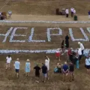 Kent villagers spell out 'help us' with bottles after week without water