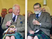 King Charles sips whisky at Mey Highland Games in Scotland