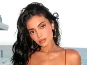 Kylie Jenner admits she wants boobs so big they 'walk in rooms before she does'
