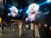 Madonna installation and wildfires in Europe: photos of the weekend