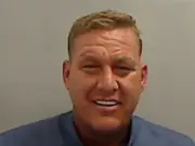 Man who fled UK after far-right disorder jailed after airport arrest