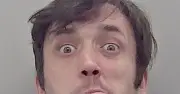 Man who strangled woman twice pictured sticking tongue out in mugshot