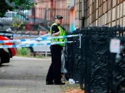 Manhunt Launched After Two Men Found Dead in Glasgow Flat