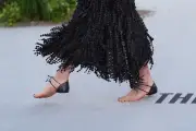 Margaret Qualley attends The Dog Stars premiere in barefoot Chanel sandals