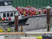 Migrants escorted back to UK after mega-dinghy nearly collapses