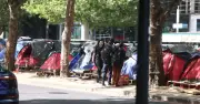 Migrants in London tent city reveal begging earnings