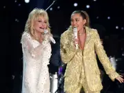 Miley Cyrus pays tearful tribute to godmother Dolly Parton after death