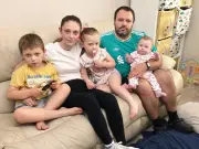 Mum and baby sleeping on floor in West Derby housing row