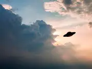 Mystery flying saucer zooms past passenger jet over UK airport
