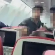 Passenger restrained with cable ties after trying to open plane door mid-flight