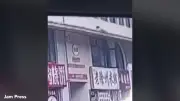 Passer-by catches two-year-old girl falling 20ft from ledge in China
