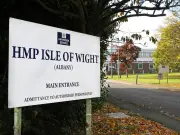 Prison psychologist cleared to return to work after topless photo scandal