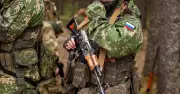 Putin soldier tied to tree and thrown into pit for two days