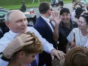 Putin swarmed by children during lockdown visit to Novosibirsk