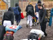 Reading Festival hit by torrential rain as second day brings mudbath