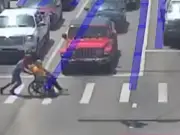 Real-life Spiderman rescues man in wheelchair from traffic