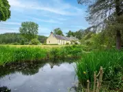 Retro Scottish cottage with boating pond and island hits market