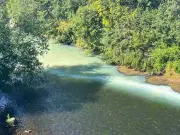 River Irwell turns 'milky green' after suspected organised dump