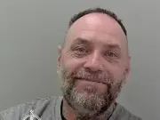 Robber who threatened shop worker jailed for four years
