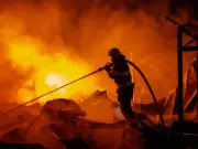 Russian missile blitz on Kyiv kills 15 and wounds 42 in 'deliberate civilian attack'