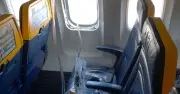 Ryanair passenger partially sucked out of window after engine part hits plane