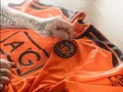 Salford City unveil new orange home kit with Beckham and Neville