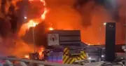 Salford fire: Huge blaze rips through building on busy road