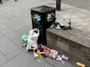 Salford Quays residents slam 'disgusting' overflowing bins and dog poo bags in trees