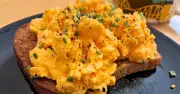 Scrambled eggs are creamier if you add 1 common ingredient to the bowl before cooking them