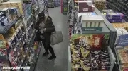 Shoplifter Caught on Camera Stuffing Detergent Under Coat