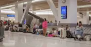 Sydney Airport cancellations and delays as strong winds hit flights