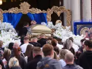 Teen killed in wrong-way crash laid to rest in gold casket