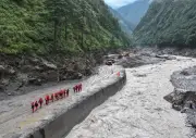 Tibet-Nepal flash floods halt rescue as death toll rises