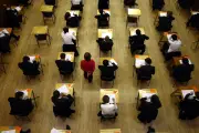 Top GCSE grades rise but key pass rate returns to pre-pandemic levels
