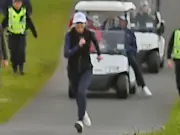 Trump aide Natalie Harp pictured sprinting after President's golf cart