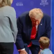 Trump Stops Toddler Falling Off Stage, Swipes at Biden