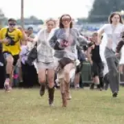 UK festivals battered by rain and storms as new warnings issued