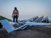 Ukrainian drone strike on Russian city kills 12, hits refinery