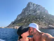 Victoria Beckham cracks rare smile in swimsuit in loved up snaps with David