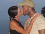 Victoria Beckham Shares Rare PDA Kiss with David in Holiday Photos