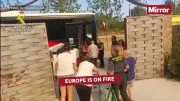 Wildfires rage near Athens as heatwave grips Europe