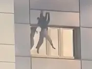 Woman jumps from burning Berlin high-rise into firefighter's arms
