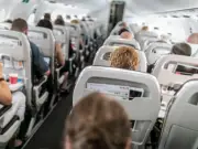 Woman Refuses Seat Swap, Shocked to See 'Son' Is Adult