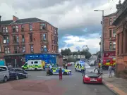 Woman taken to hospital after Glasgow flat fire, street reopens